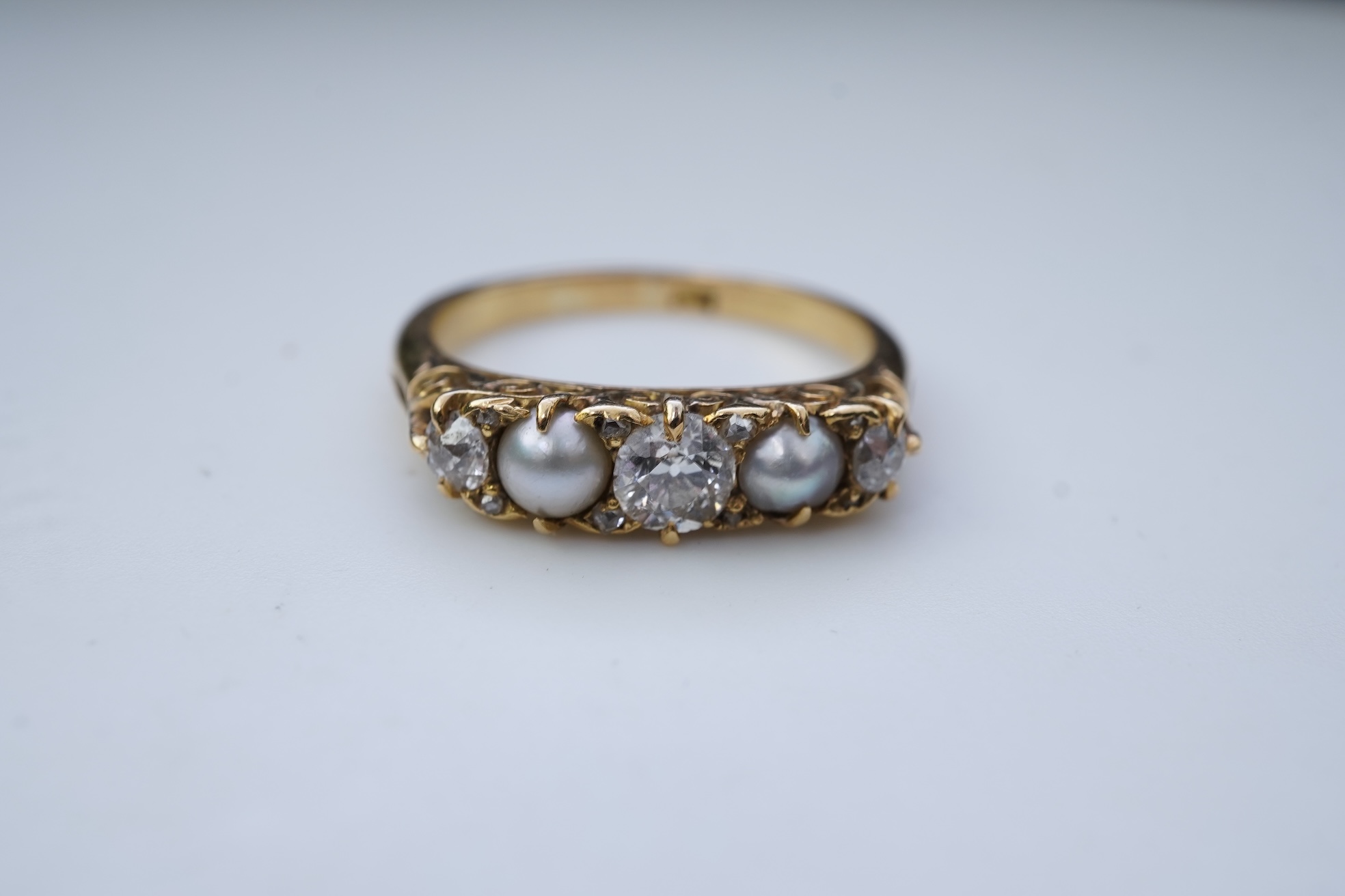 A five-stone pearl and diamond ring, early 20th century